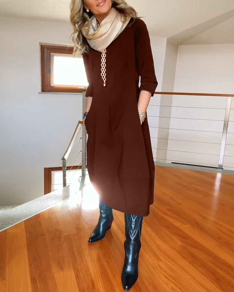 Robe élégante de couleur unie avec poche et col rond